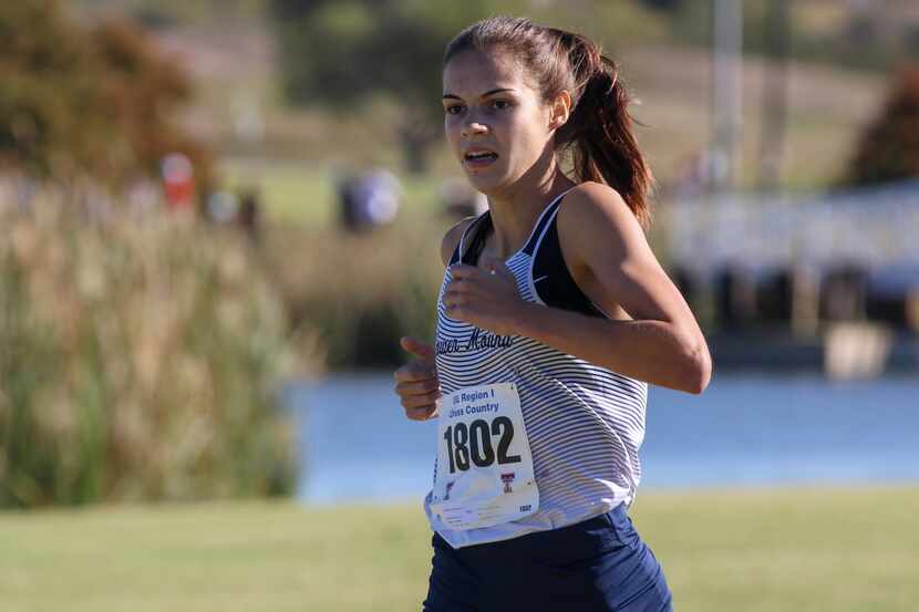 Flower Mound’s Samantha Humphries finishes off the victory in the Class 6A Region I girls...
