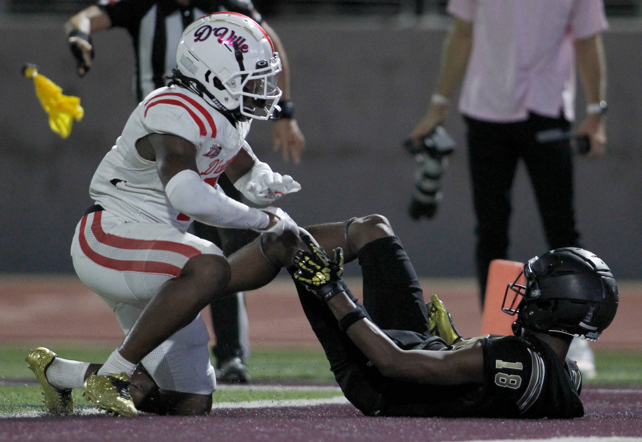 Duncanville cornerback Braylon Edwards (7), left, is flagged for interference as he was...