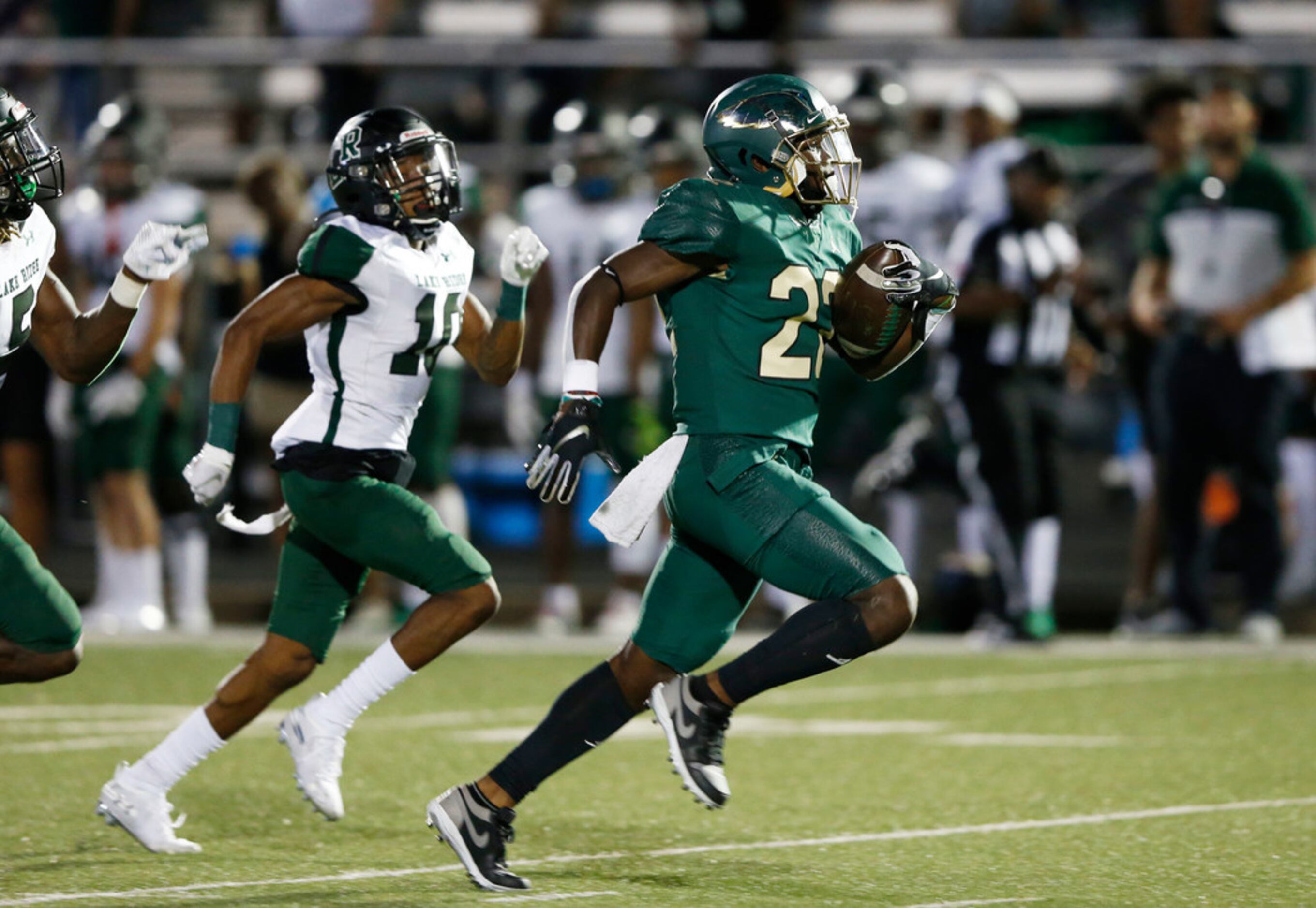 DeSoto's Jyison Brown (22) rushes up the field as he is chased by Mansfield Lake Ridge's...