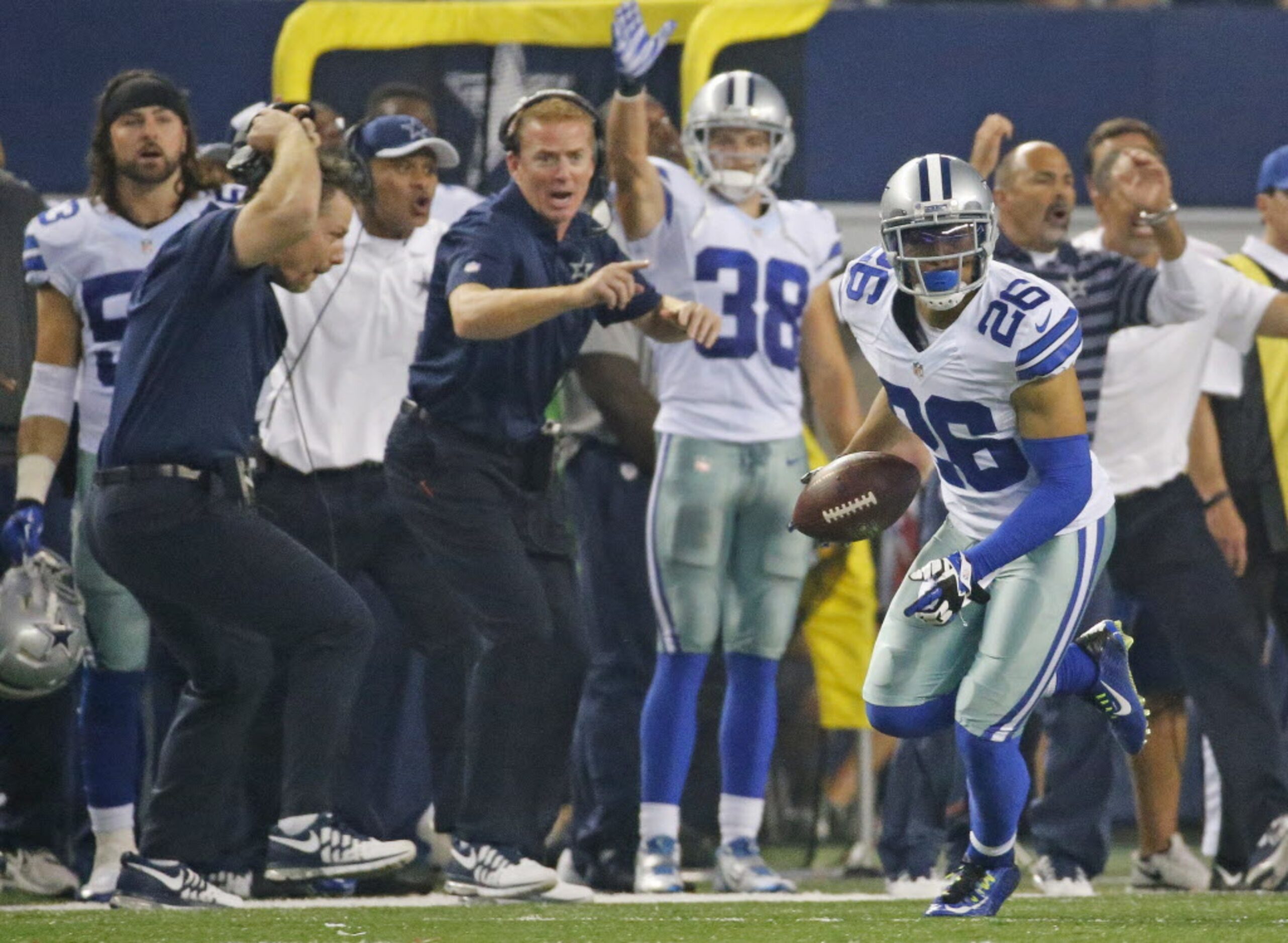 Dallas Cowboys defensive back Sterling Moore (26) picks up a New Orleans fumble as the...