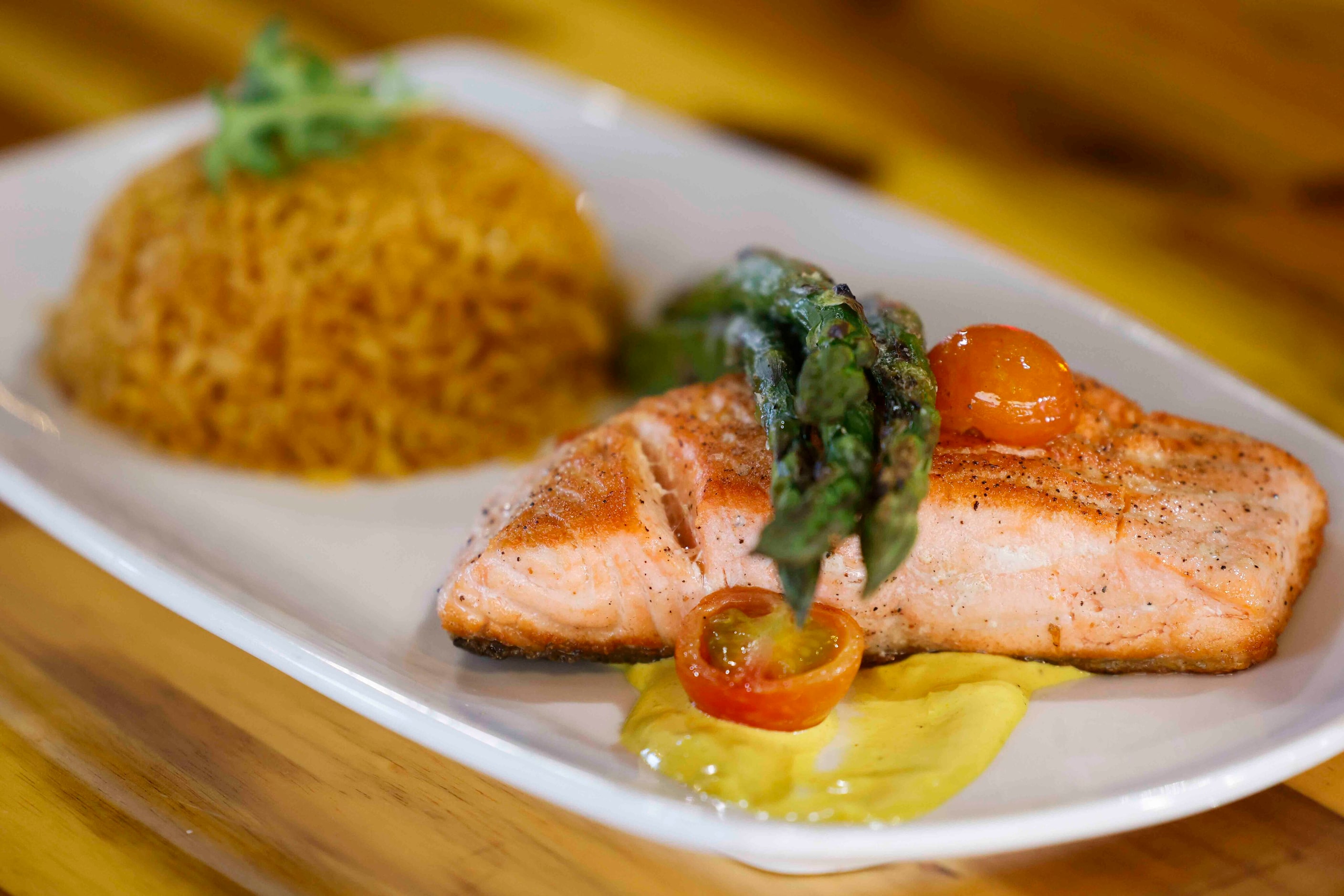 Salmon can come several ways at Cafe Nubia. Here, it's served over curry cream sauce for a...