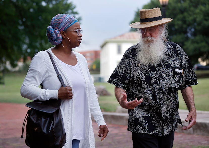 Storyteller Gene Helmick-Richardson (right) visits with Remembering Black Lives member...