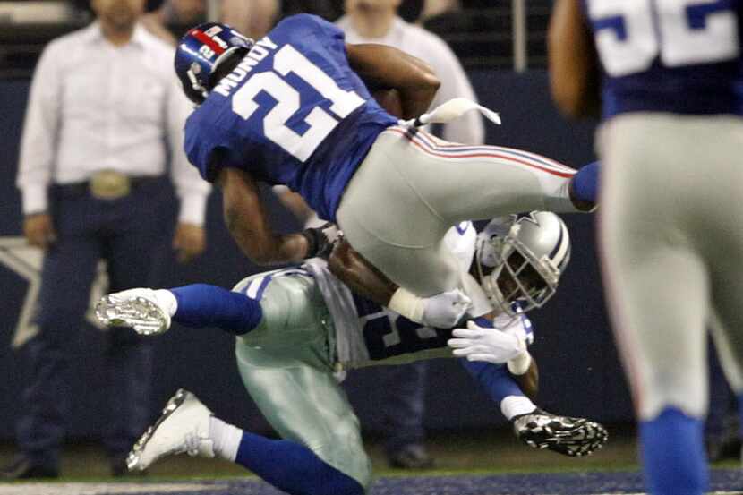 Dallas Cowboys running back DeMarco Murray (29) stops New York Giants free safety Ryan Mundy...