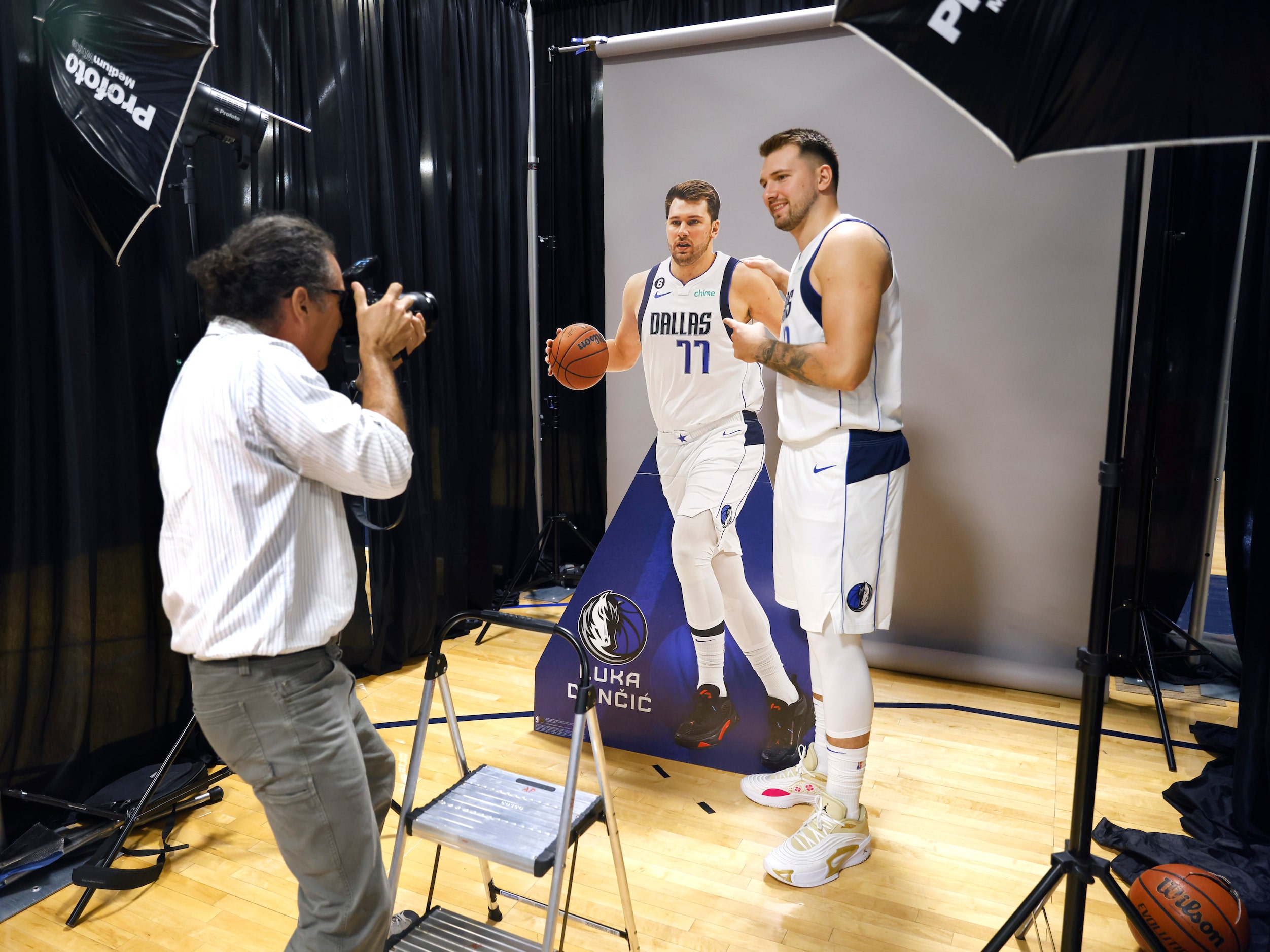 Dallas Mavericks guard Luka Doncic (77) poses with a cutout of himself for Associated Press...