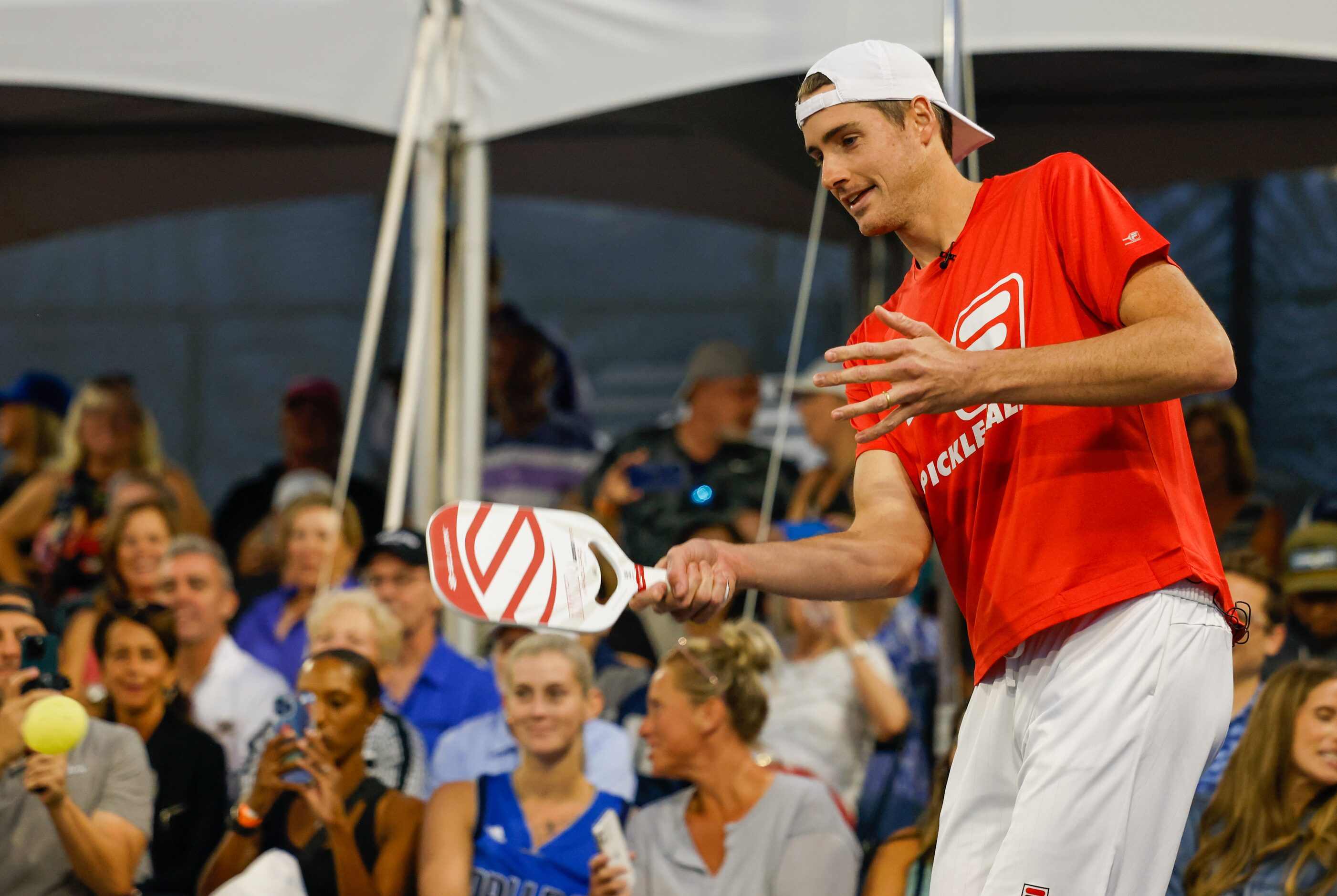 John Isner plays a doubles match of pickleball with Scottie Scheffler, Jordan Spieth and...