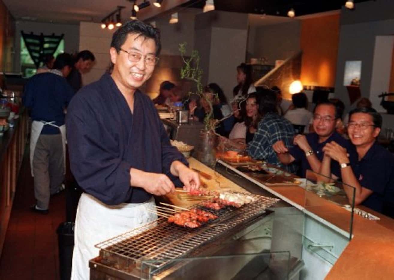 Teiichi Sakurai grilling yakitori at Teppo in 1995, the year it opened.
