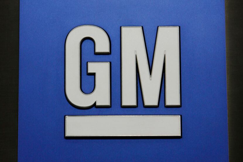 FILE - This Jan. 25, 2010, file photo, shows a General Motors Co. logo during a news...
