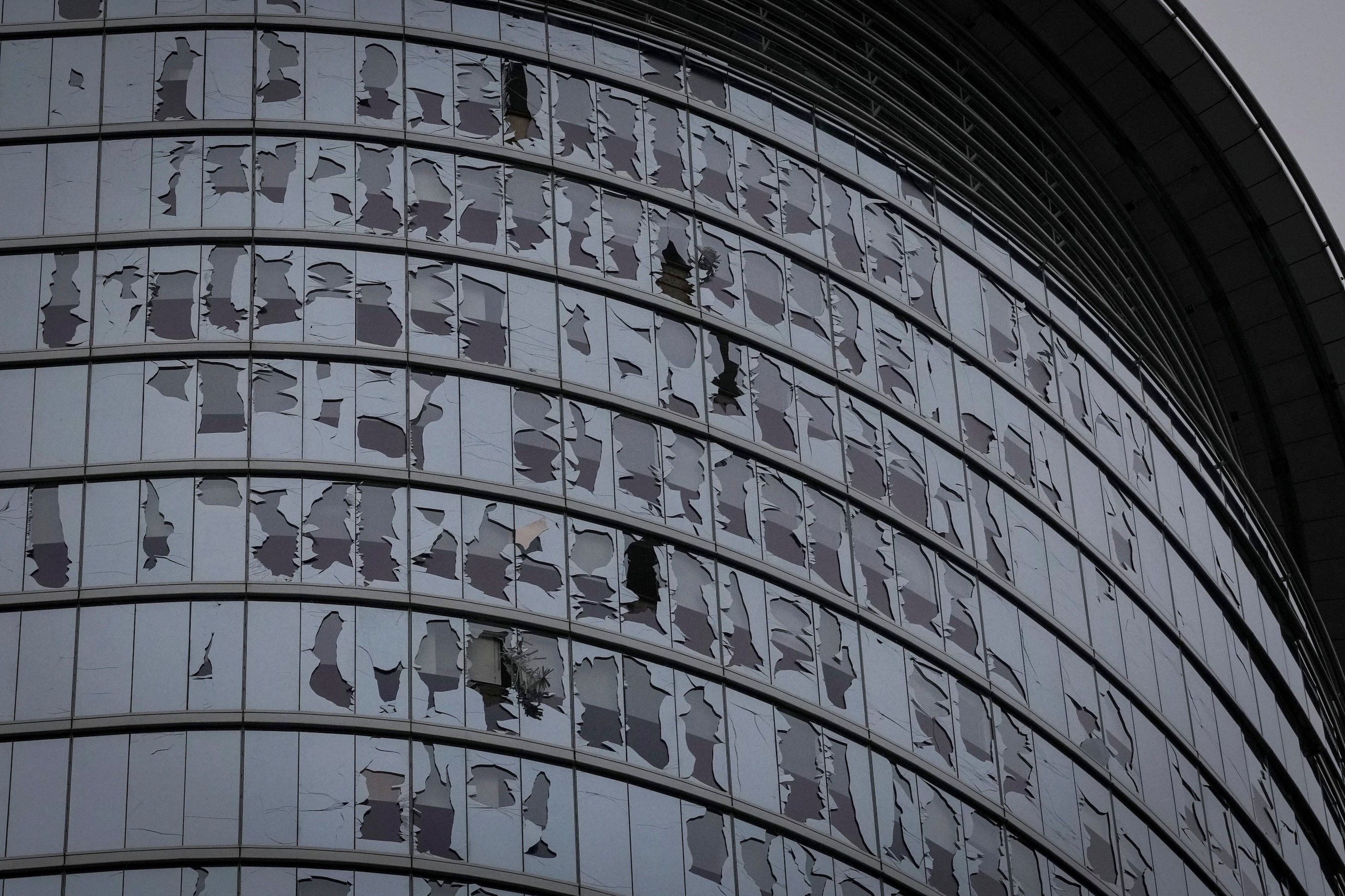 Broken windows are seen following last night's storm Friday, May 17, 2024, in downtown...