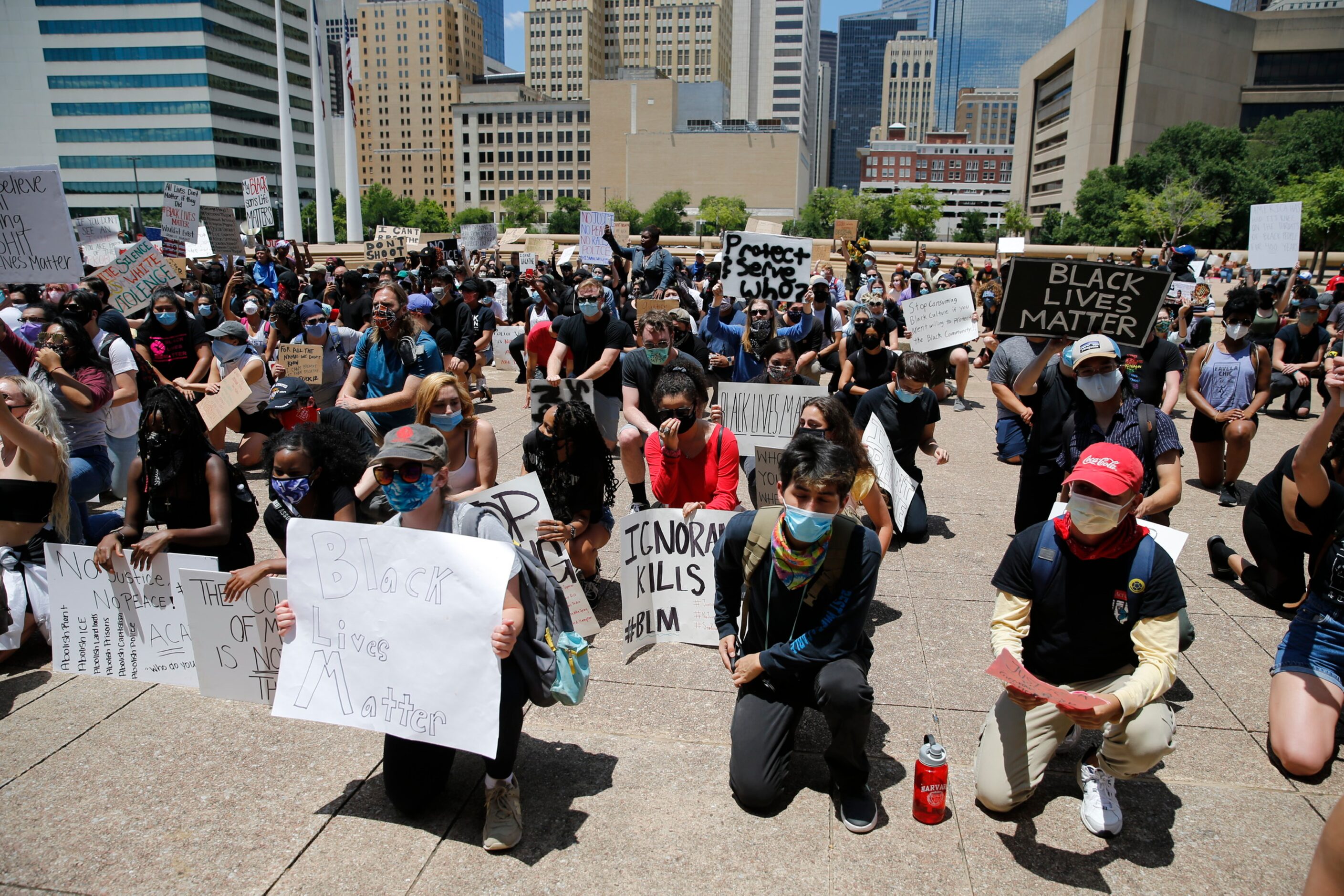 Protesters rally during a demonstration against police brutality in downtown Dallas, on...