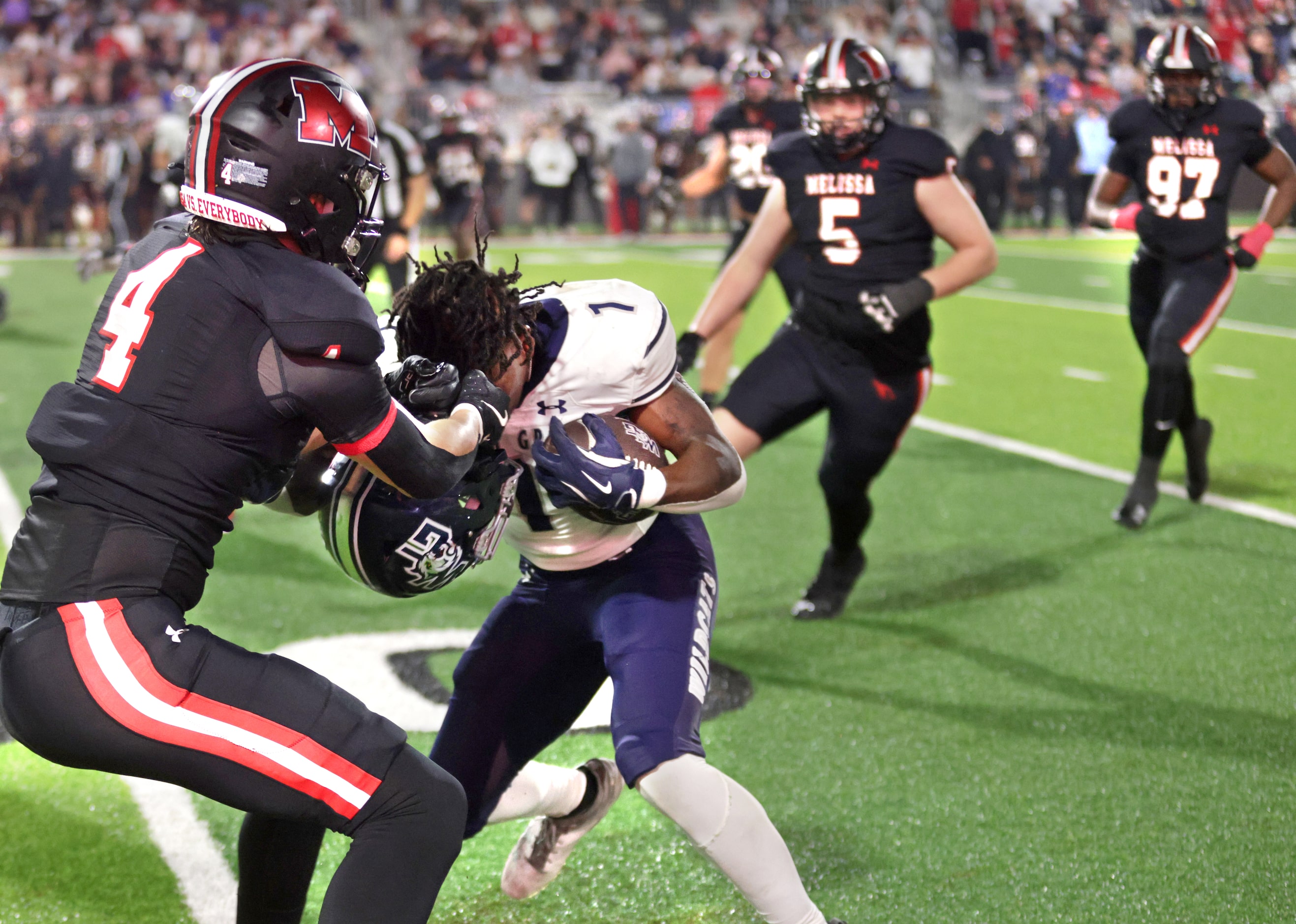 Walnut Grove player #1 Cam Newton loses his helmet to Melissa player #4 Max Corbin during...