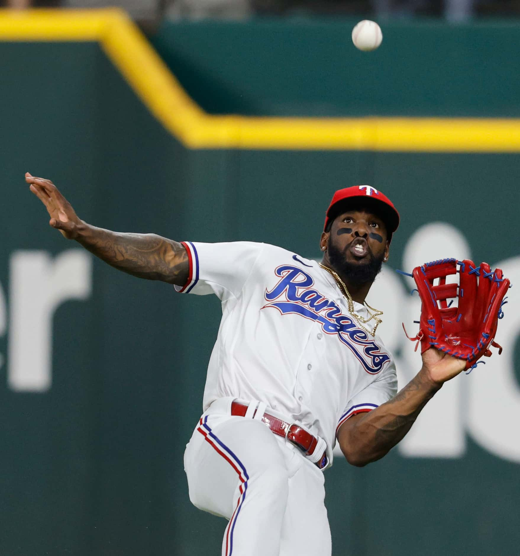 Texas Rangers right fielder Adolis Garcia (53) catches a fly ball hit by Houston Astros...