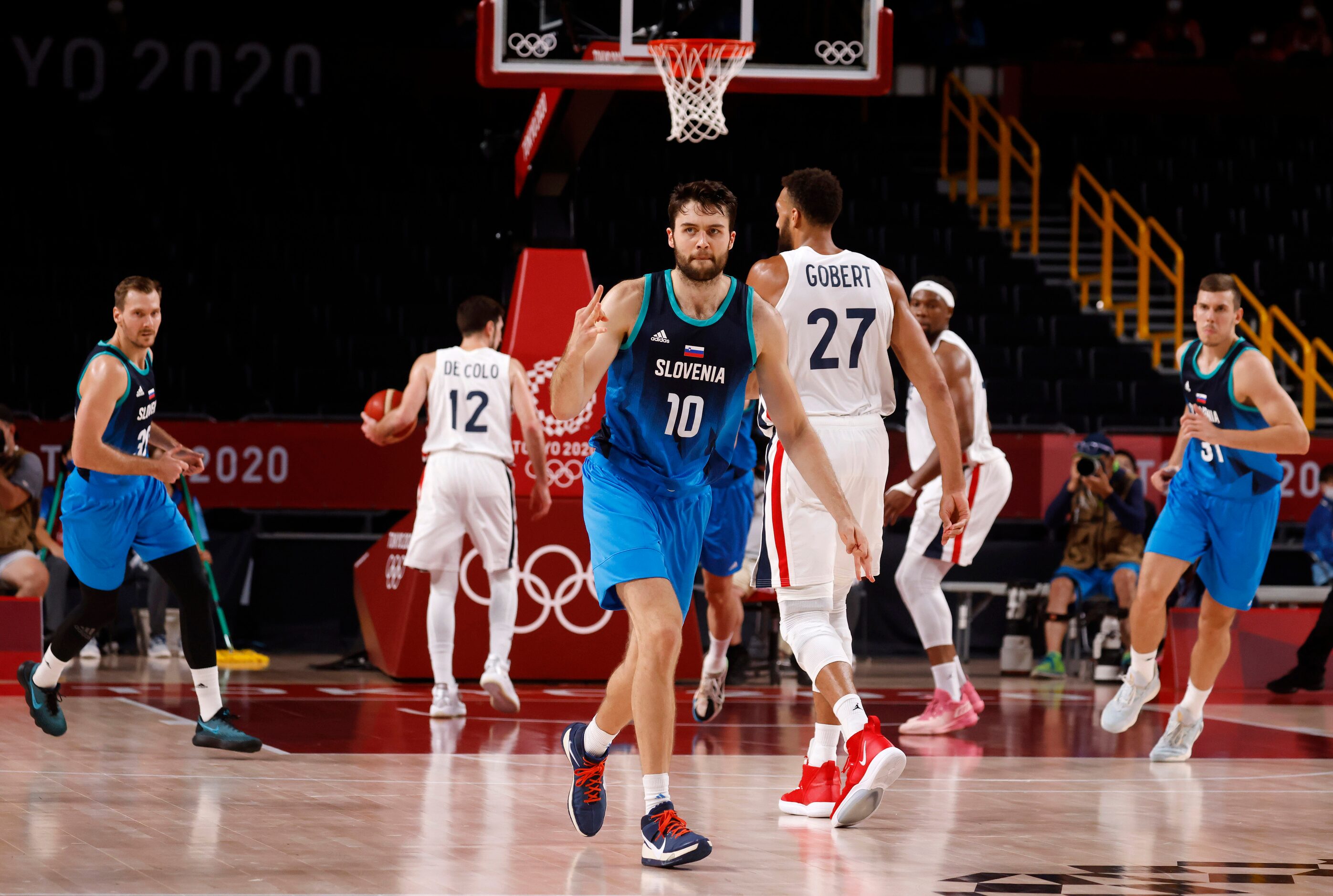 Slovenia’s Mike Tobey (10) celebrates after making a three pointer in a game against France...