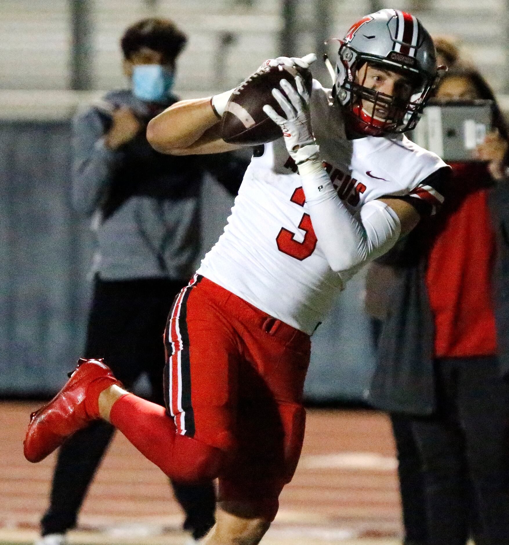 Flower Mound Marcus wide receiver Tyler Schott (3) pulls in a pass in the end zone for a...