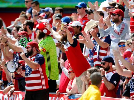 Fans react to a close play on the field during the first half as FC Dallas hosted the San...