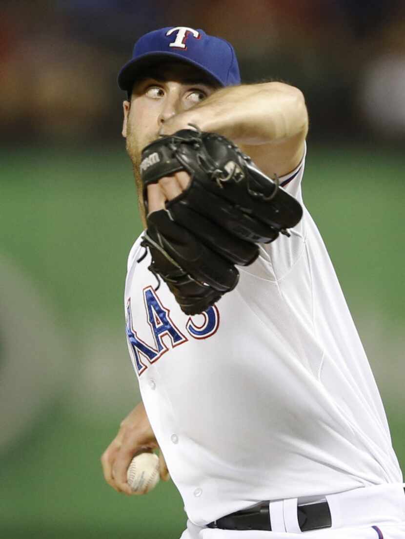 Texas Rangers relief pitcher Anthony Bass (63) pitches during the sixth inning in a game...