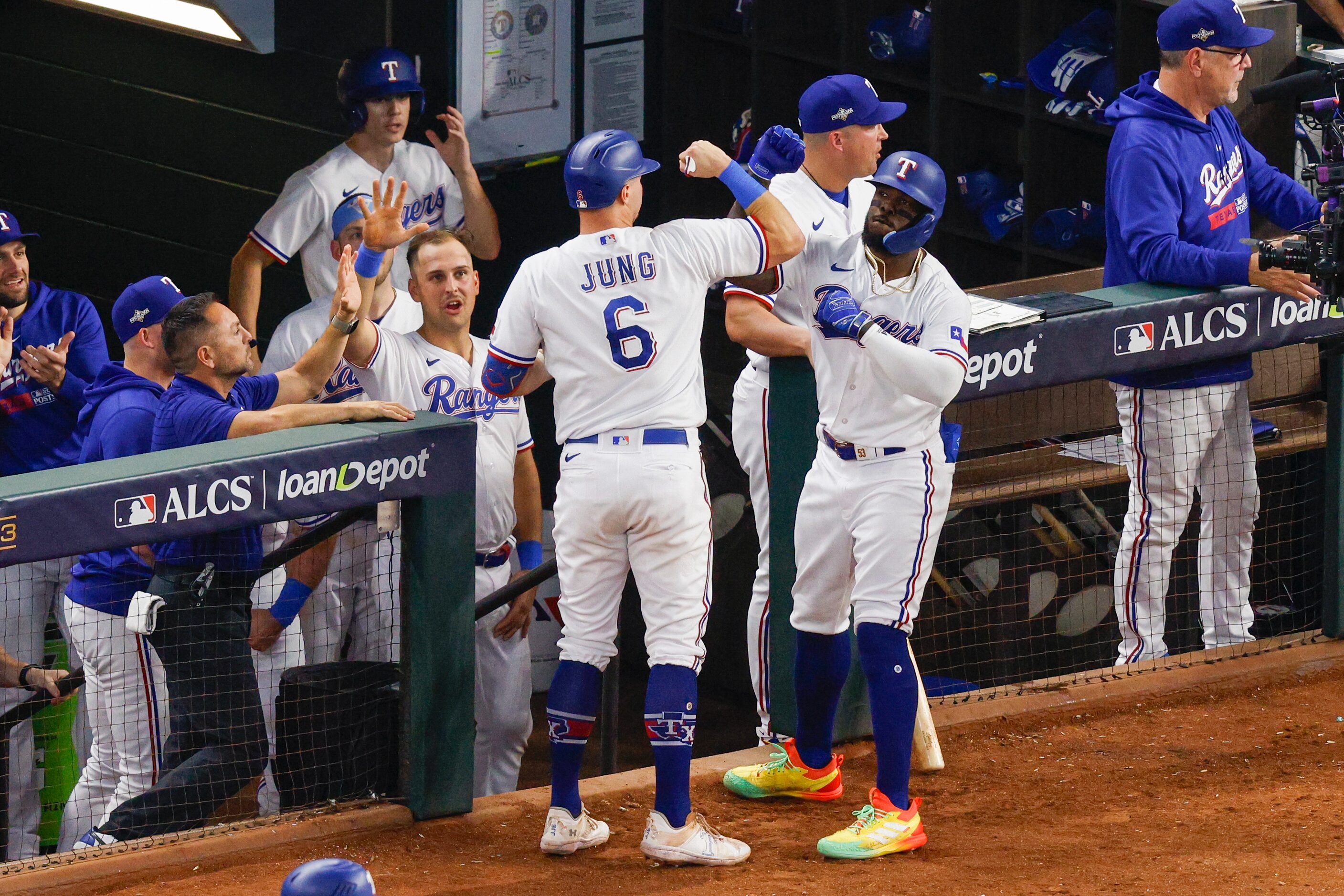 Texas Rangers right fielder Adolis Garcia (53) celebrates his home run with third baseman...