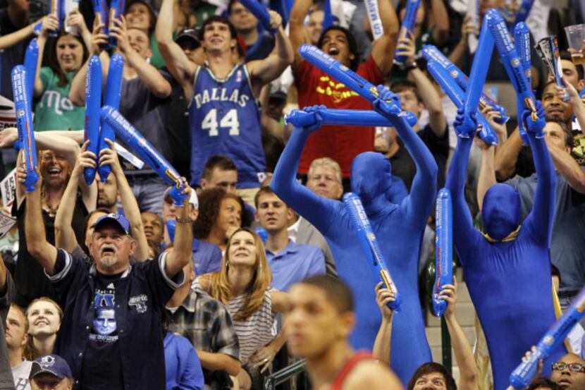Fans cheer during first half NBA basketball first-round playoff action between the Dallas...
