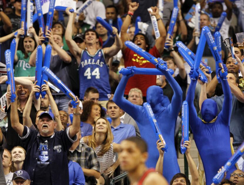 Fans cheer during first half NBA basketball first-round playoff action between the Dallas...