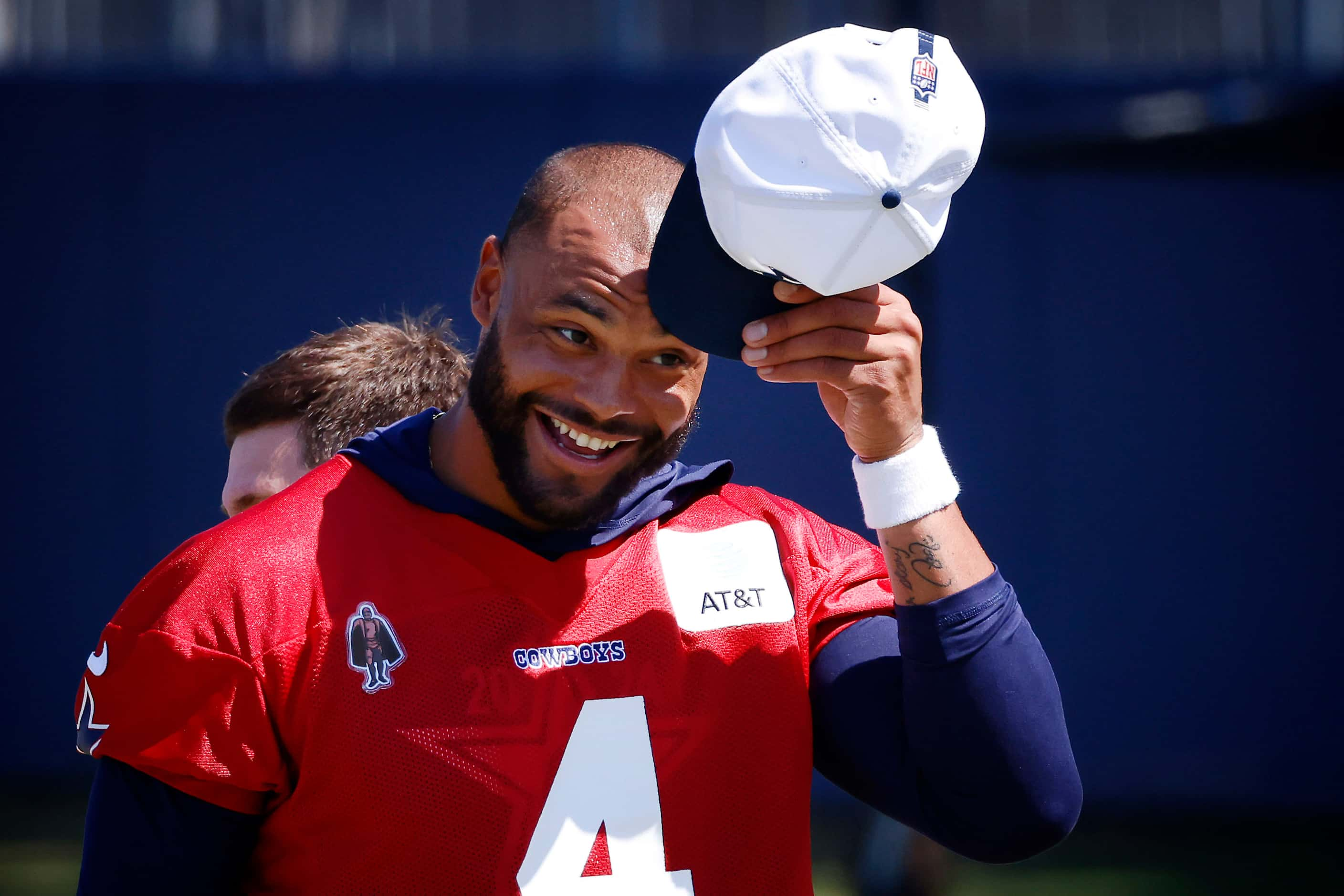 Dallas Cowboys quarterback Dak Prescott (4) tips his hat during a mock game workout in...