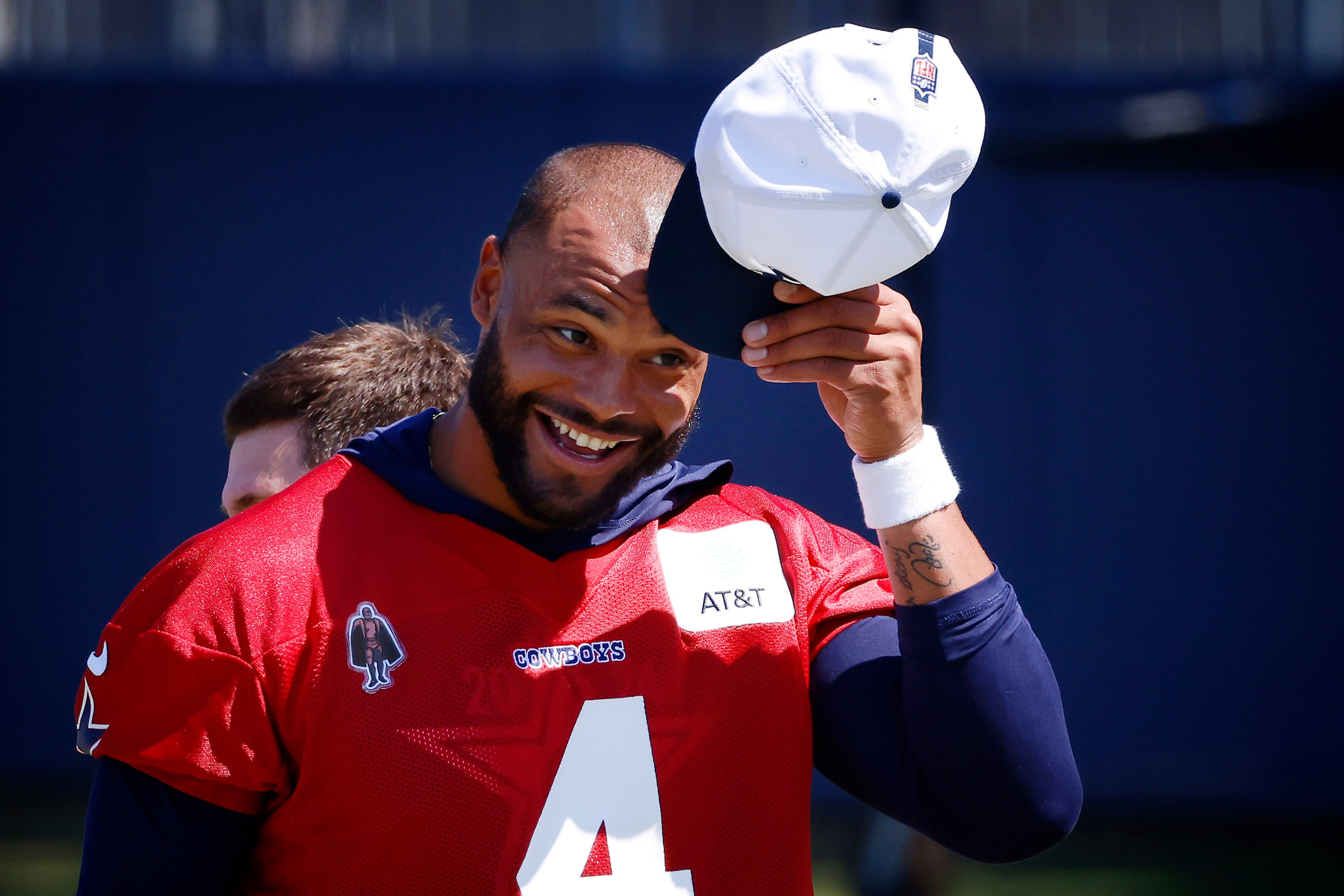 Dallas Cowboys quarterback Dak Prescott (4) tips his hat during a mock game workout in...