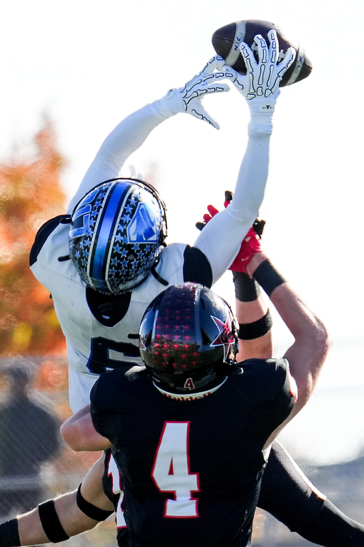 North Crowley wide receiver Quentin Gibson (6) makes a leaping catch over Coppell defensive...