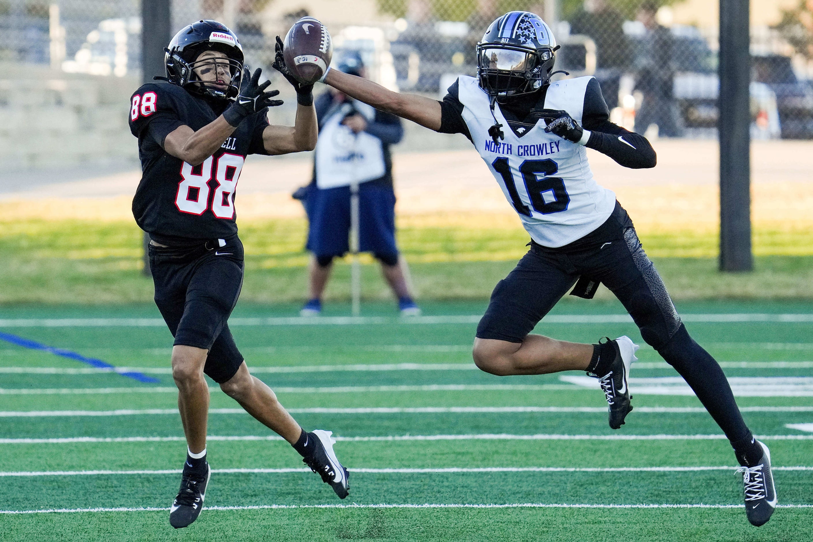 North Crowley defensive back Elijajuan Houston (16) breaks up a pass intended for Coppell...