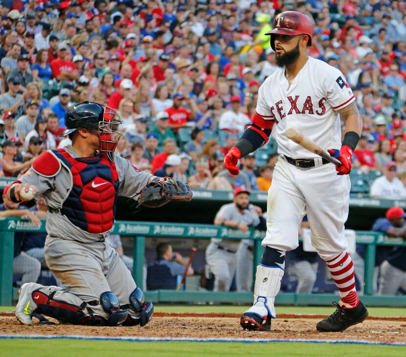 FILE - Rougned Odor (right) strikes out during a game against the Boston Red Sox at Globe...