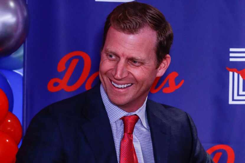 Southern Methodist University's head football coach, Rhett Lashlee sits at a news conference...