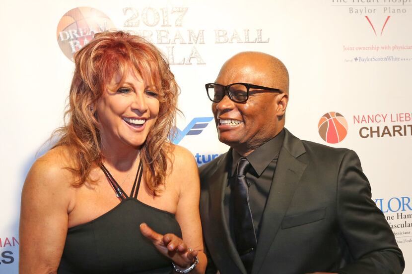 Former Dallas Police Chief David O. Brown shares a laugh with Nancy Lieberman on the red...