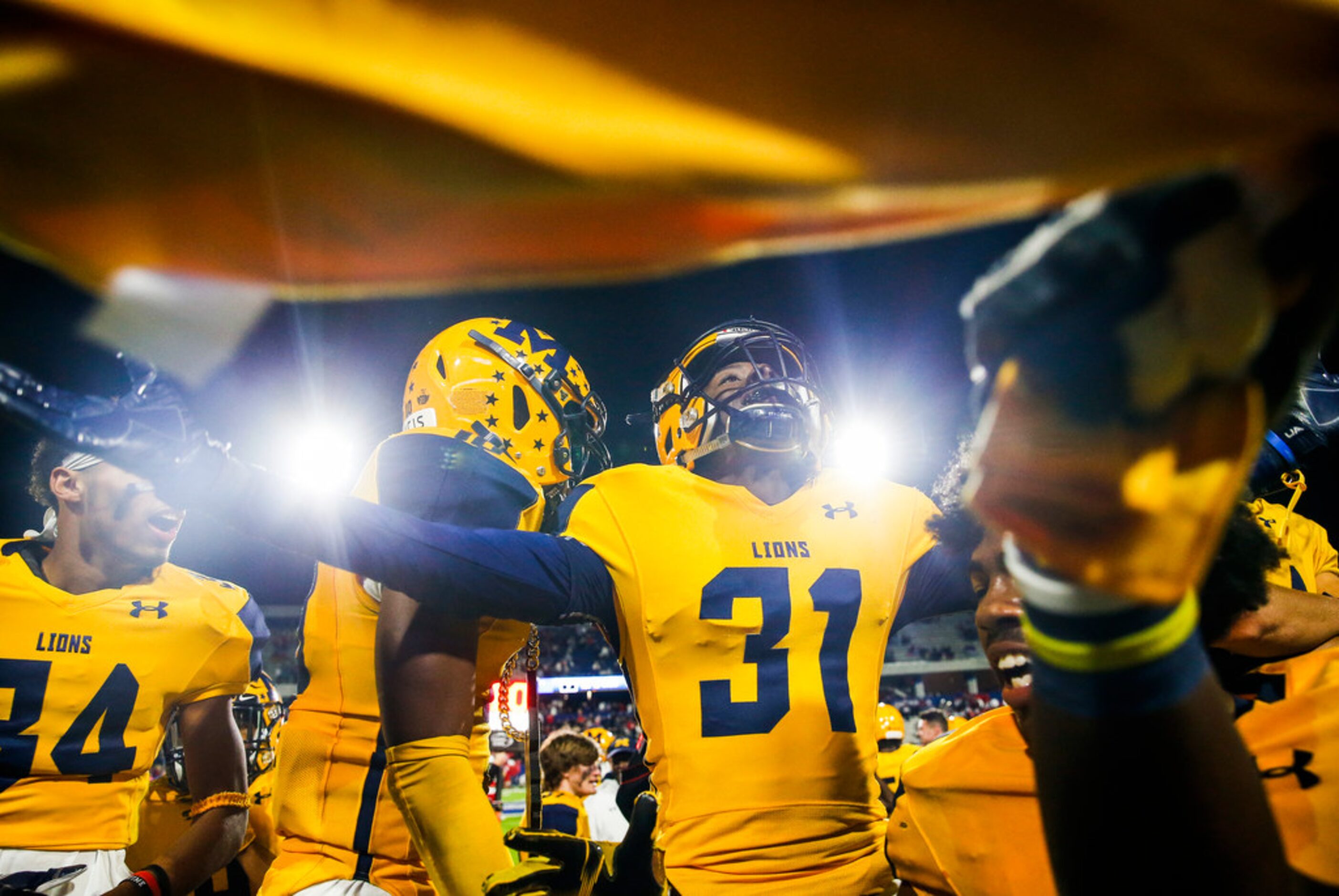 McKinney players celebrate in the final moments of their win over McKinney Boyd during a...