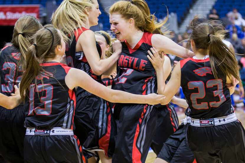 Argyle forward Vivian Gray (12) (middle) and her teammates celebrate a 58-54 win over Waco...