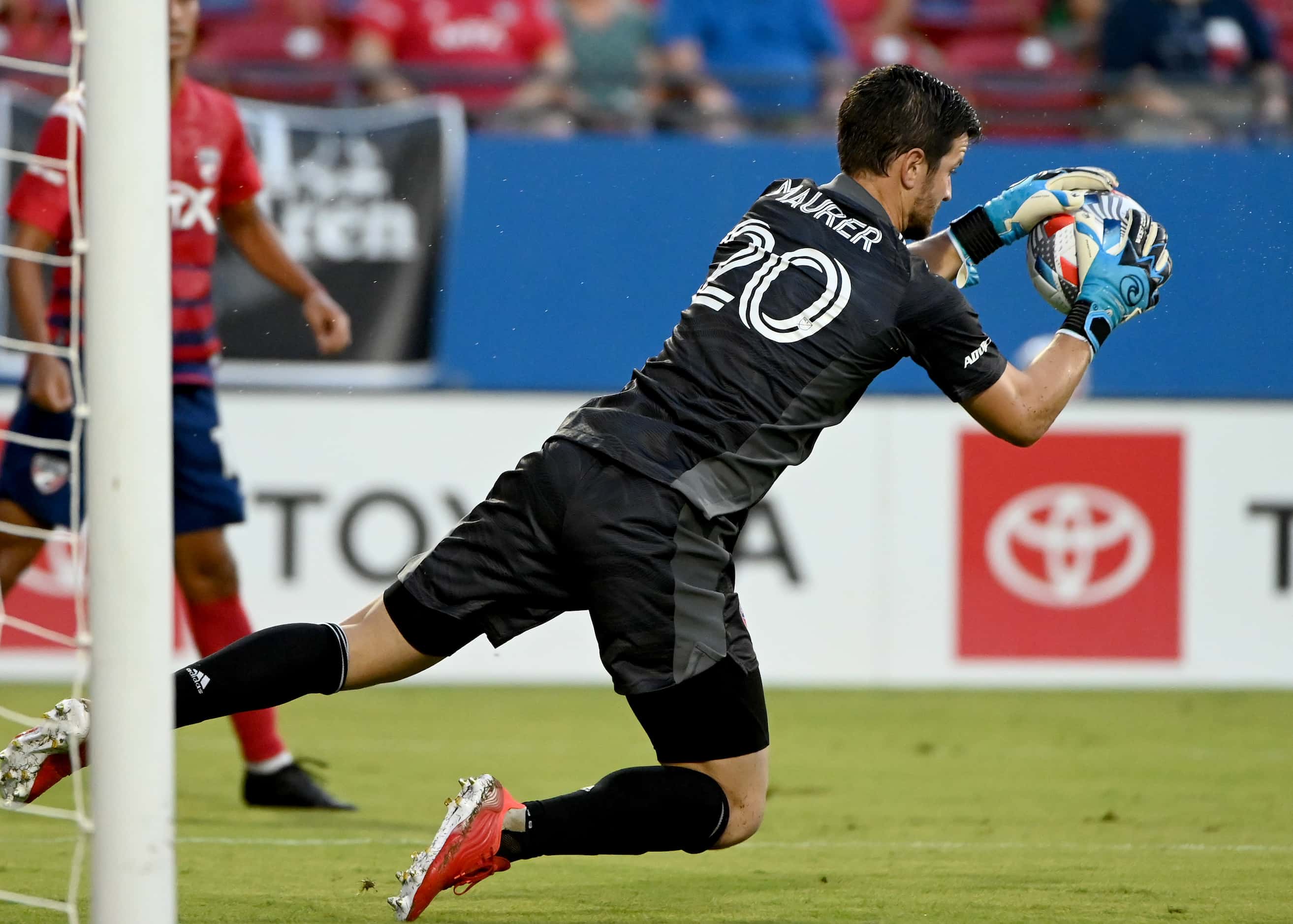FC Dallas goalkeeper Jimmy Maurer (20) makes a save in the first half during an MLS match...