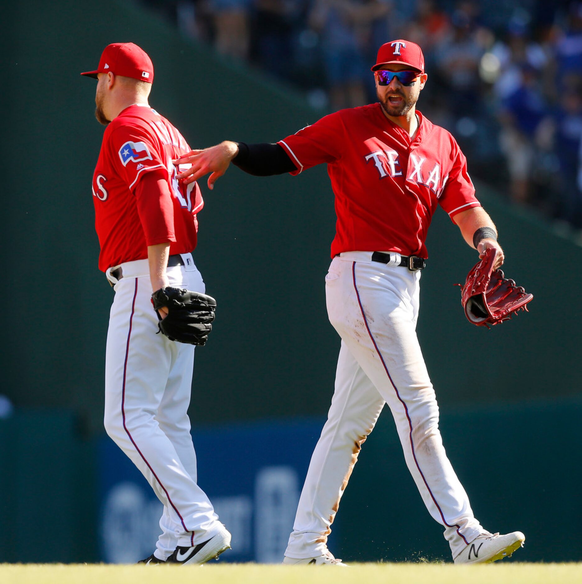 Texas Rangers relief pitcher Shawn Kelley is congratulated by teammate Joey Gallo (right) ...