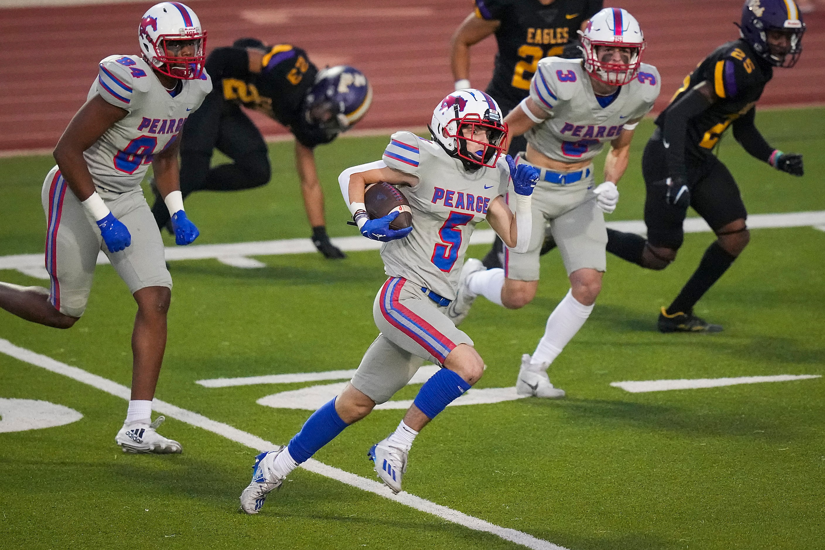 Richardson wide receiver Pearce Jack McGarry (5) breaks through the Richardson defense...