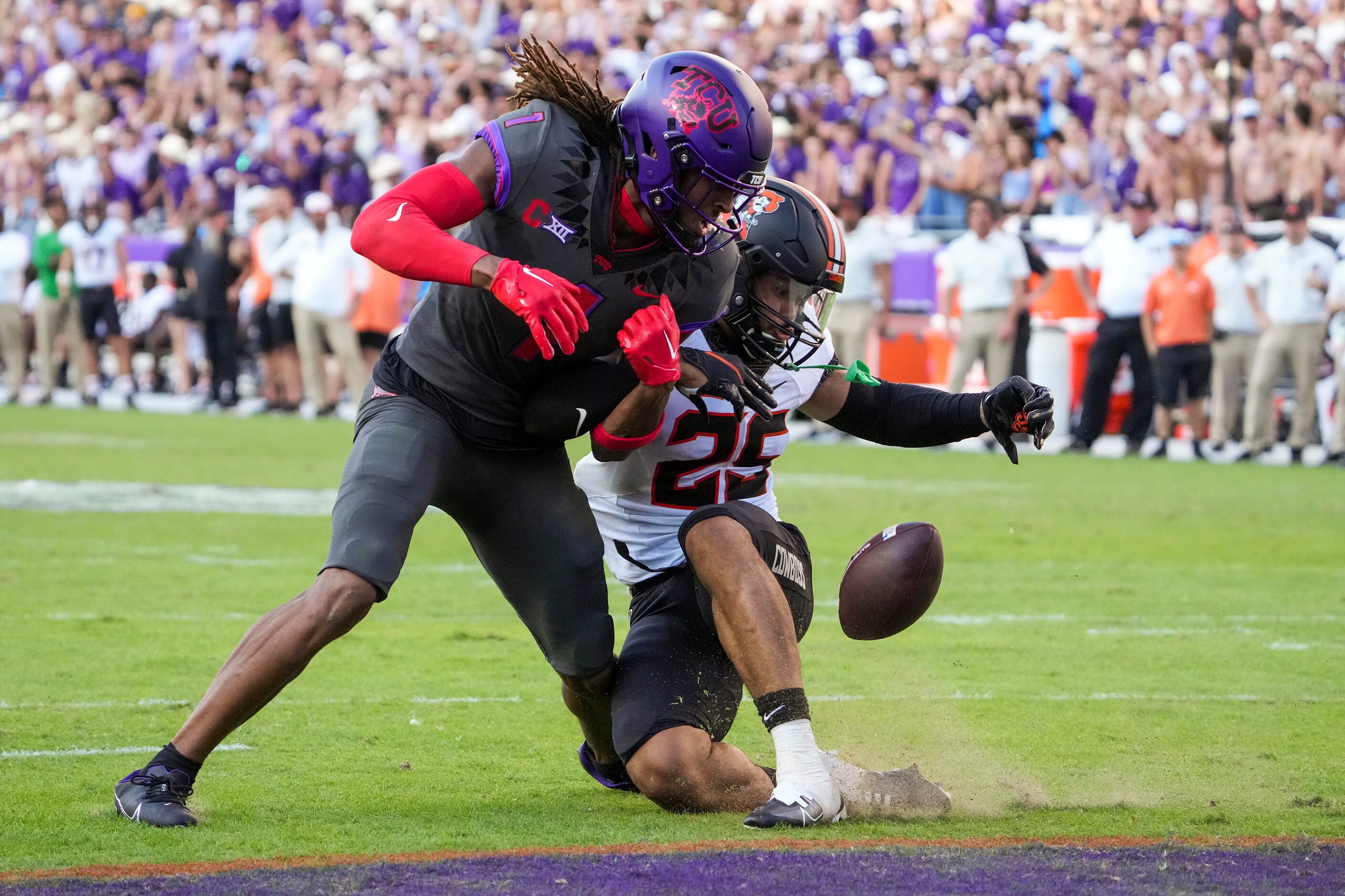 Oklahoma State safety Jason Taylor II (25) breaks up a pass intended for TCU wide receiver...