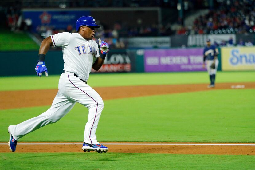 Texas Rangers Adrian Beltre (29) races for home scoring from second on a Jonathan Lucroy...