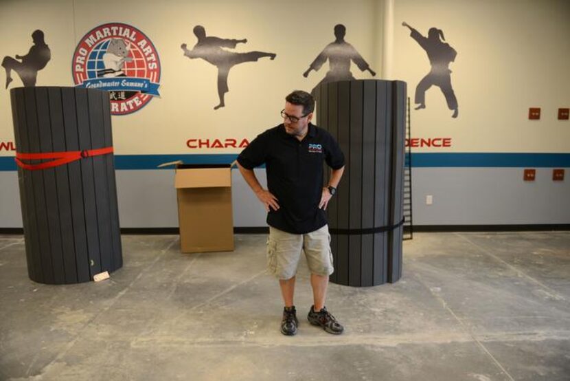 
Matthew Woody stands in his new Pro Martial Arts gym in Frisco on May 23, 2014. The gym...