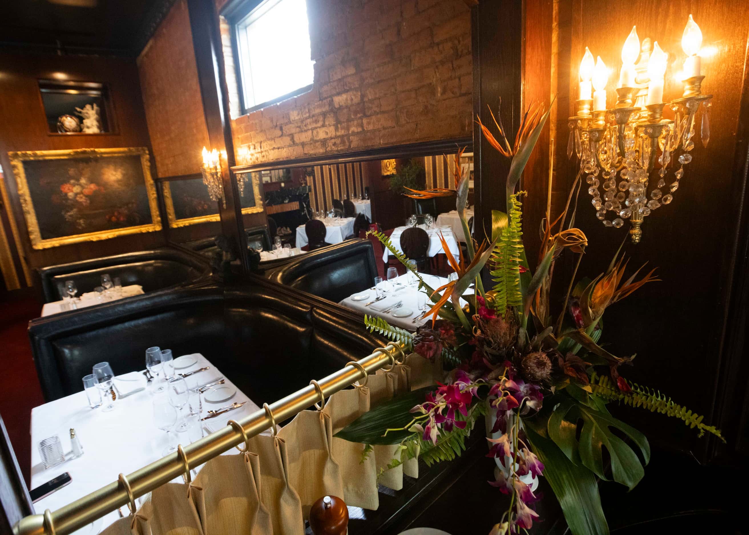 A floral arrangement decorates St. Martin's Wine Bistro’s dining room. The restaurant moved...