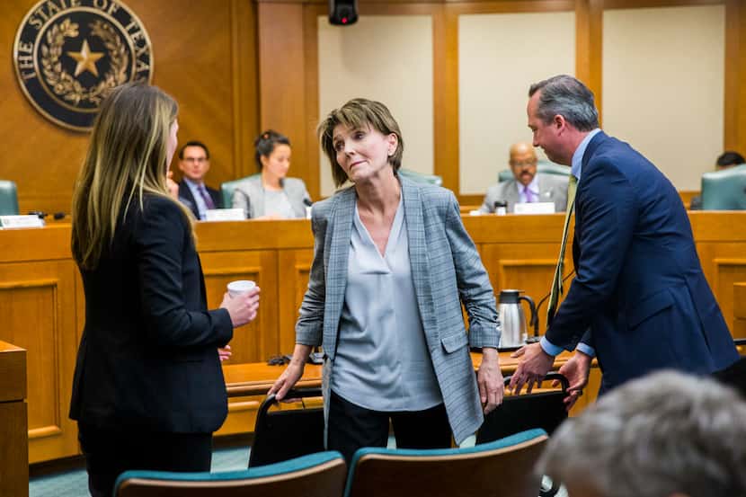 Eve Wiley (left) and her mother, Margo Williams (center), react after testifying before the...