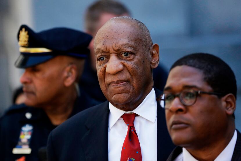 Bill Cosby, center, leaves the the Montgomery County Courthouse April 26, 2018m after being...