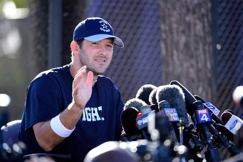 Dallas Cowboys quarterback Tony Romo speaks to the media after their afternoon practice at...