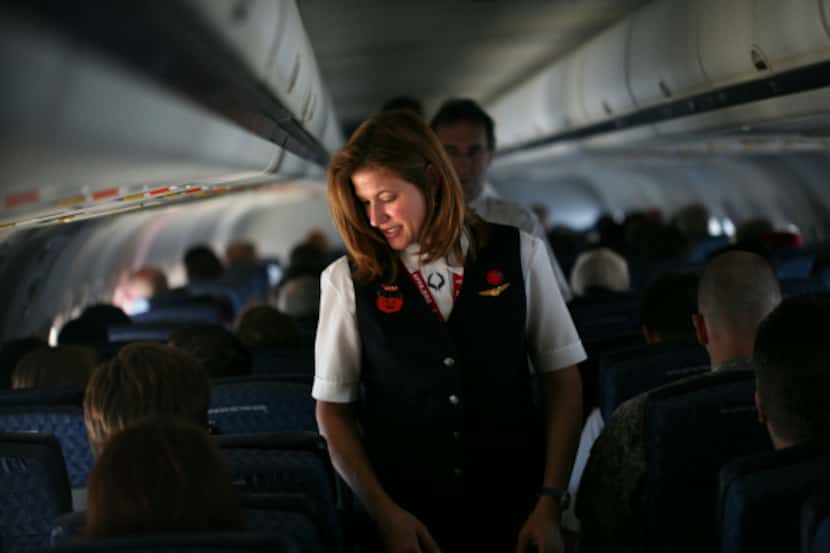 American Airlines flight attendant Kristen Heller did a routine cabin check on a flight in...