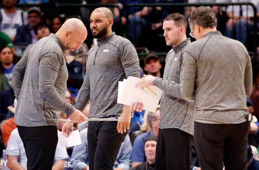 Dallas Mavericks coaching staff (from right) head trainer Casey Smith, assistants Greg St....