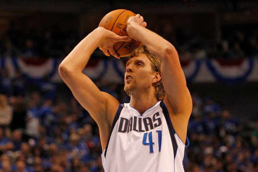Dallas' Dirk Nowitzki shoots a free throw in the fourth quarter of play in Game 1 of the NBA...