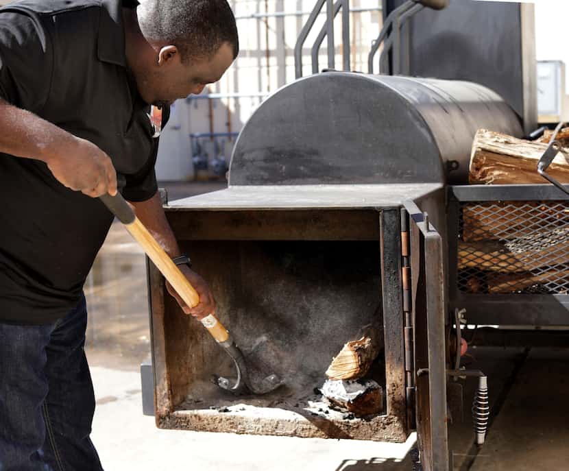 Willie Meshack Jr. prepares the smoker at Meshack’s Texas BBQ in Plano, TX, on Feb. 18,...