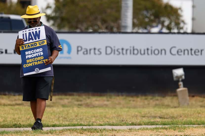 UAW local 2360 president Cleo Wynn walks the picket line Friday at a Stellantis distribution...