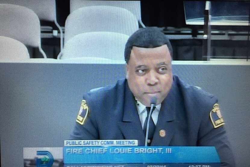  Dallas Fire-Rescue chief Louie Bright listens to council members thank him for his service...
