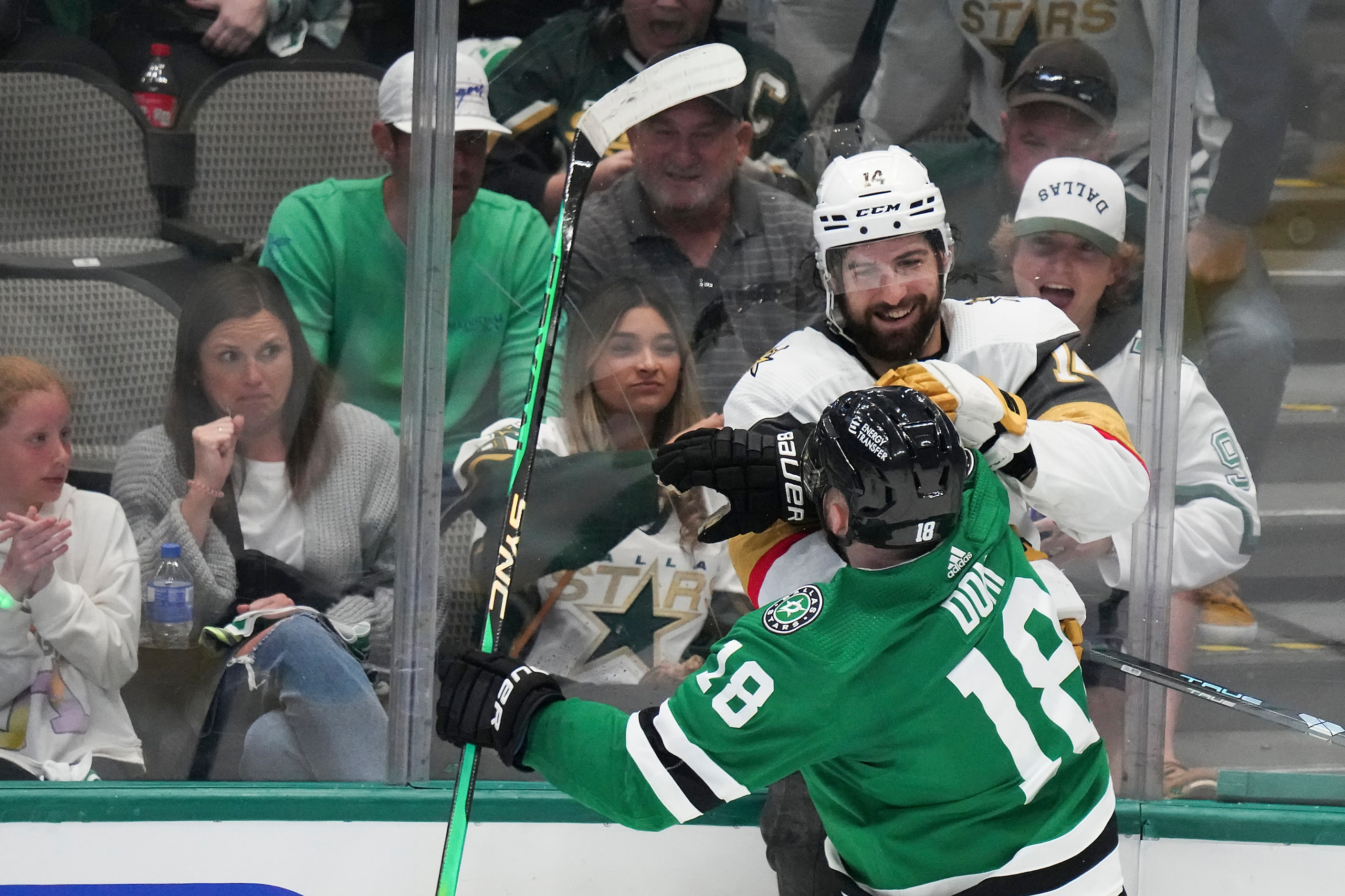 Vegas Golden Knights defenseman Nicolas Hague (14) tussles with Dallas Stars center Max Domi...