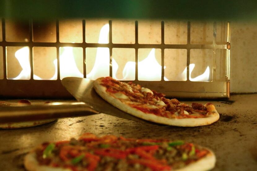 Personal pizza pies are made to order from the lunch menu of the new Coal Vines located...