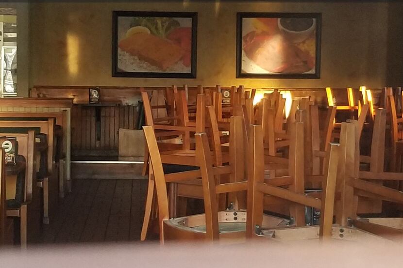 Chairs were neatly stacked on tables during the normal dinner rush on Tuesday at the...